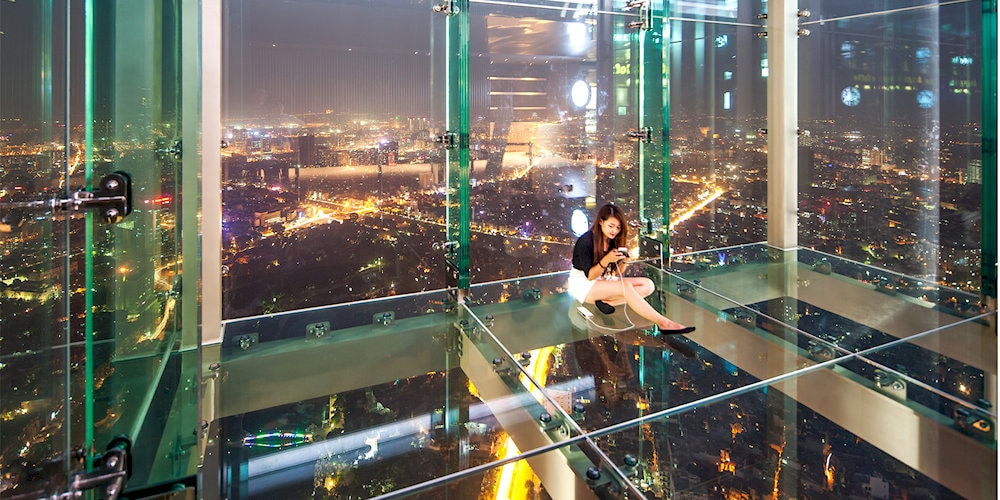 Visitors can experience Sky Walk - a glass floor that allows visitors to see the whole city from above at Lotte Center